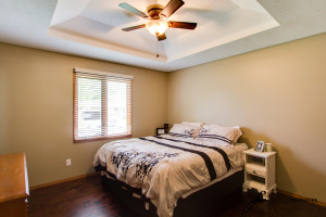 Bedroom with white and brown comforter