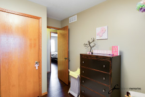 Nursery with closet door and dresser