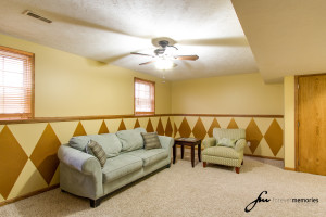 Family room with fan and couch